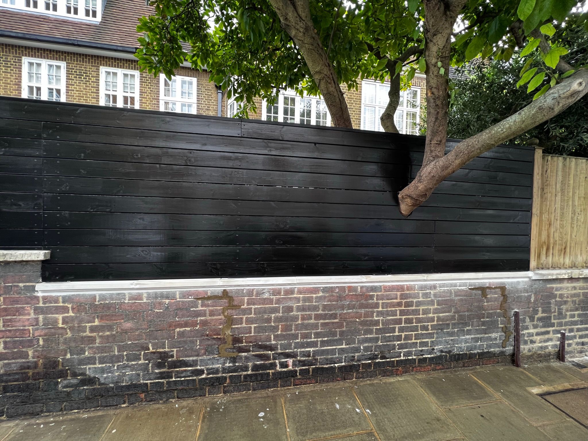 Black Timber Garden Fence — Premium Cladding