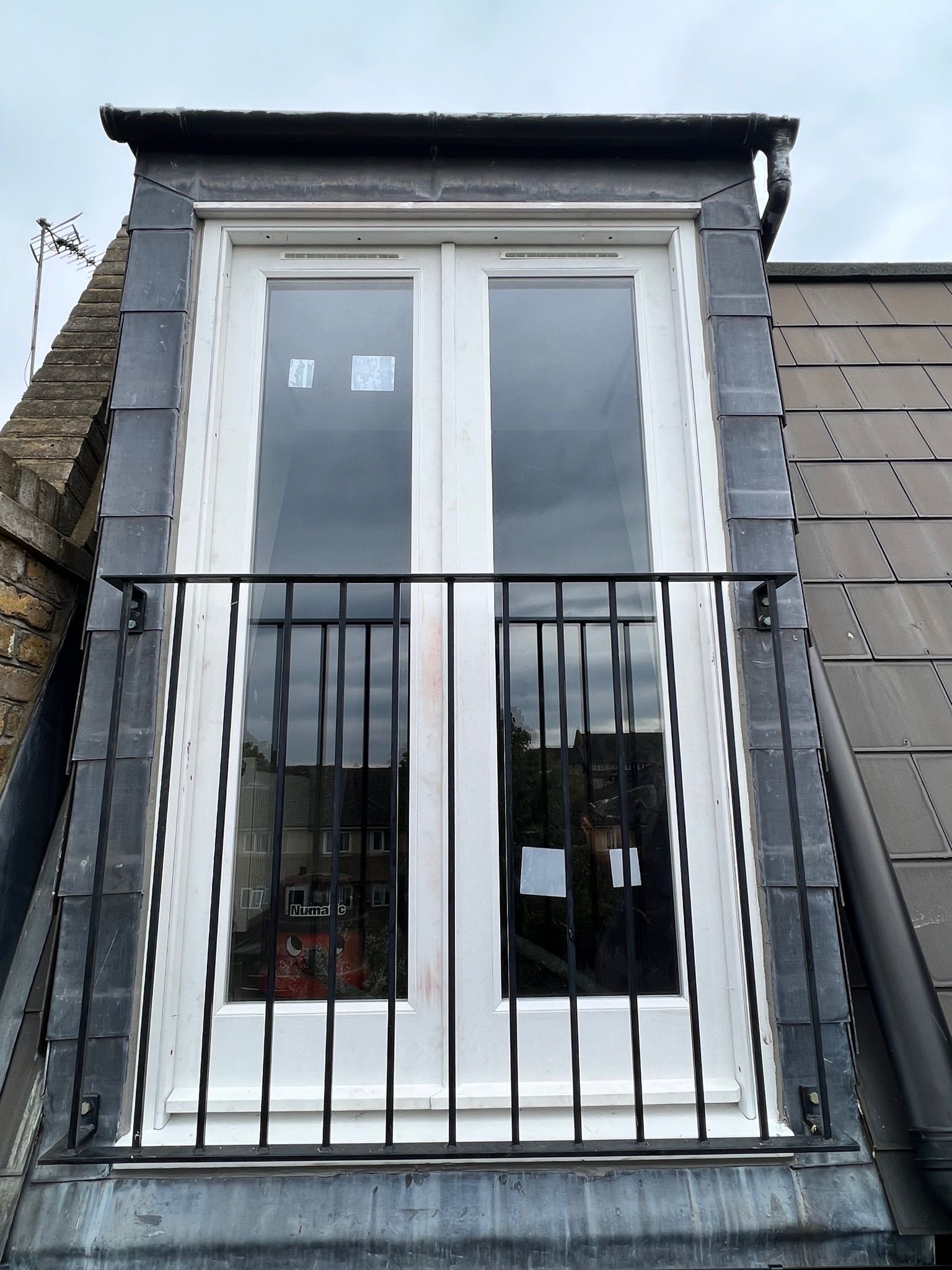 Loft Dormer Casement Window & Iron Balcony Guard — Brighton & Hove Property Repair Co. Brighton & Hove Loft Dormer Casement Window & Iron Balcony Guard — Brighton & Hove Property Repair Co. Brighton & Hove