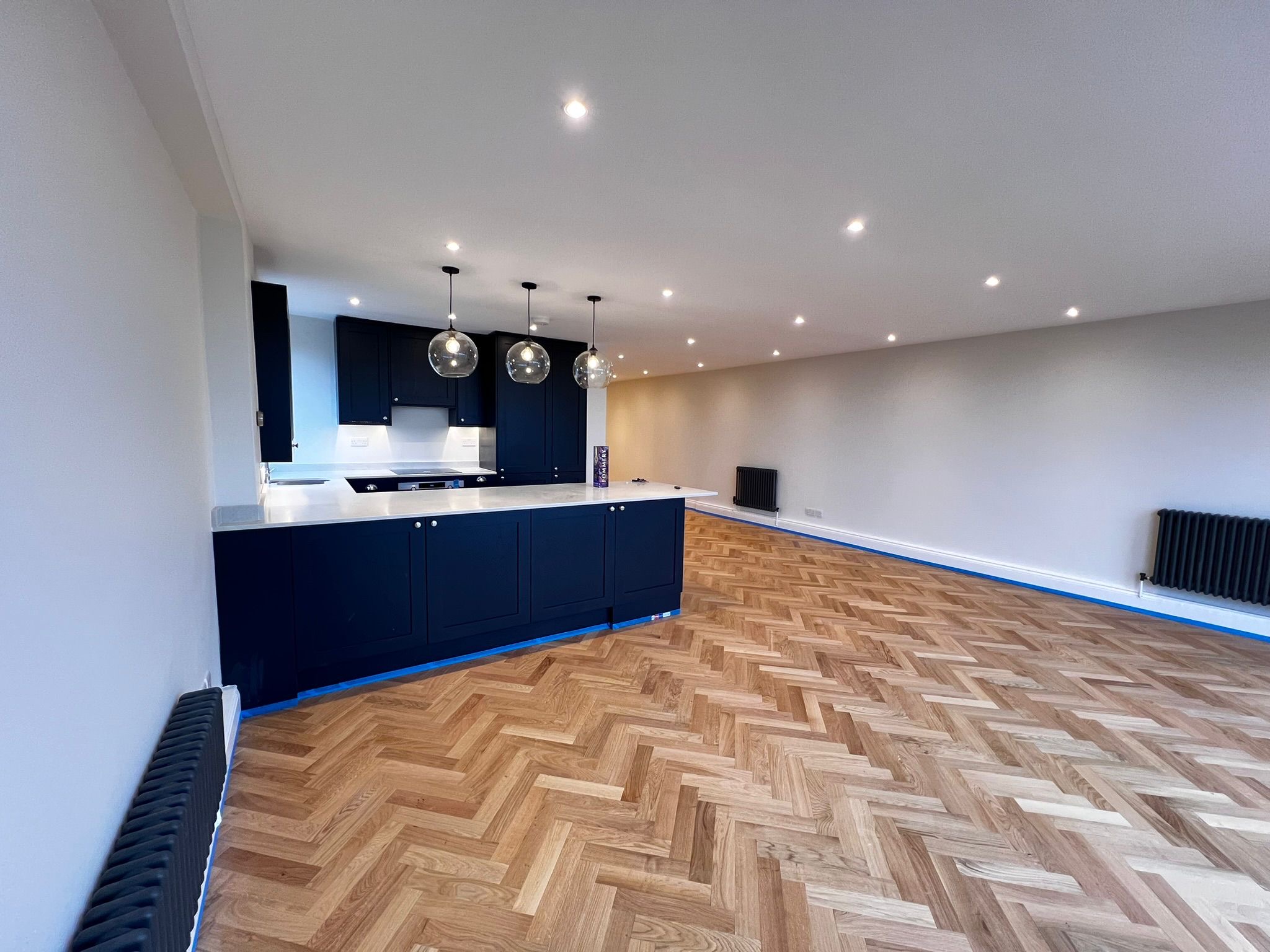 Open-Plan Kitchen & Living Space — Herringbone Parquet Floor