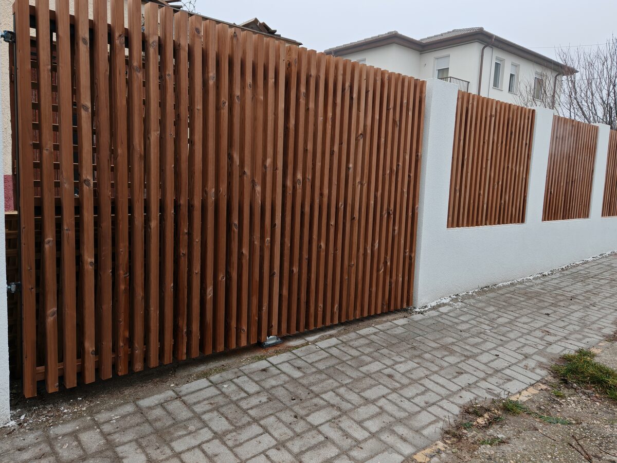 Real wood vertical slatted fence — warm brown, Hove