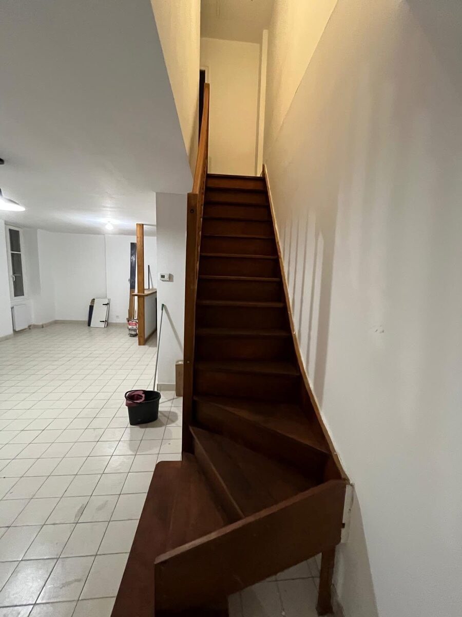 Completed staircase renovation with new timber treads and white painted risers in a Brighton Victorian property