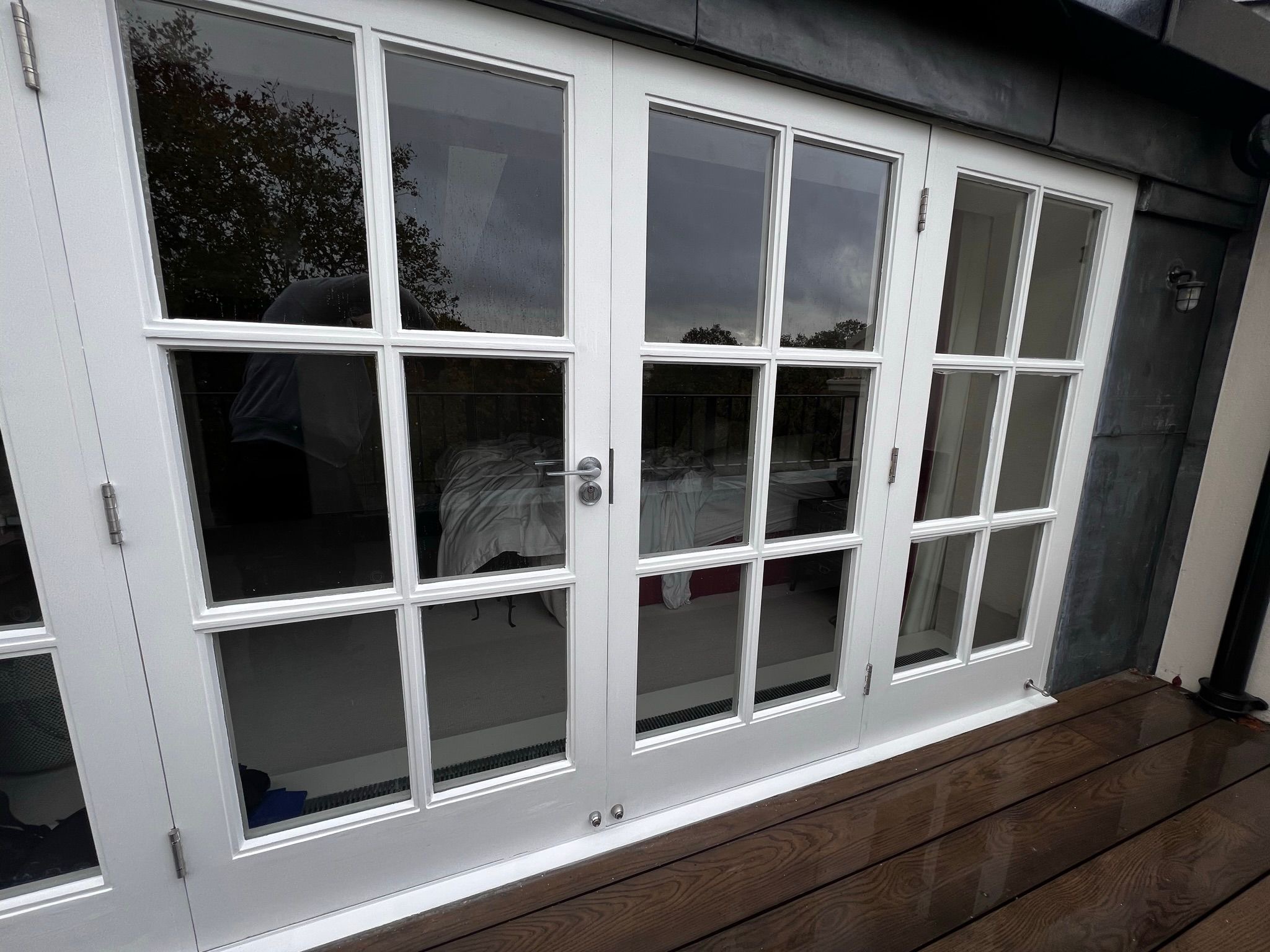 White French Doors & Hardwood Timber Decking — Brighton & Hove Property Repair Co. Brighton & Hove White French Doors & Hardwood Timber Decking — Brighton & Hove Property Repair Co. Brighton & Hove