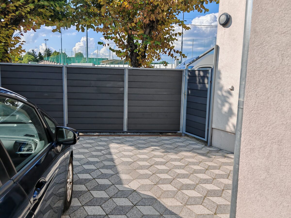 WPC composite grey panel fence with integrated gate