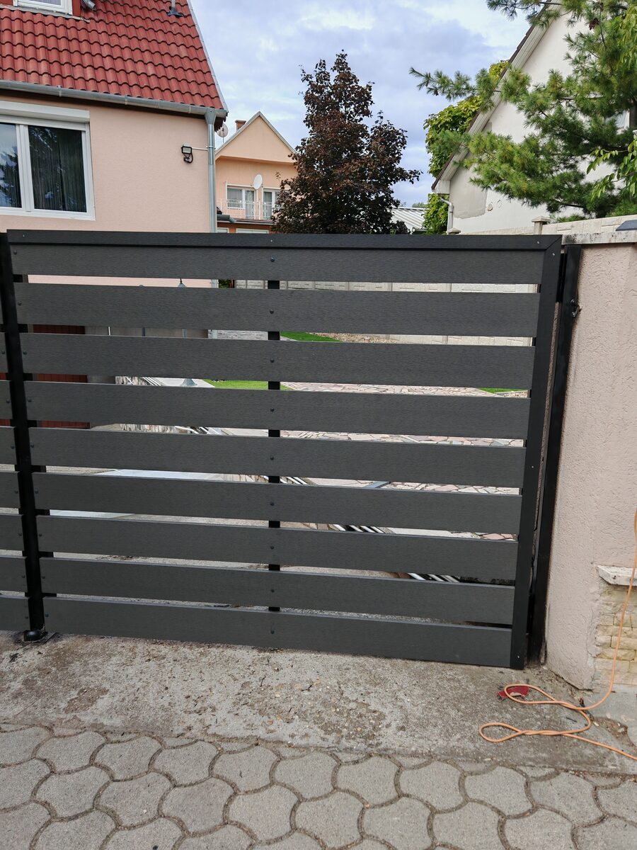 WPC composite slatted gate — large panel installation, Hove