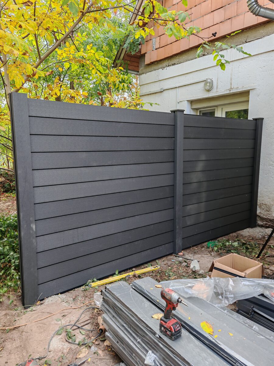 WPC anthracite grey fence — installation in progress, Hove